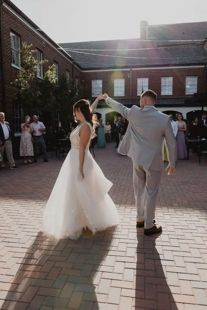 Couple dancing in the Hartman Courtyard