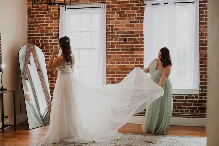 Bride and bridesmaid getting ready in The Salon