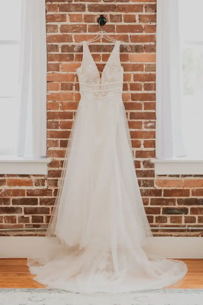 Wedding dress hanging in The Salon bridal suite