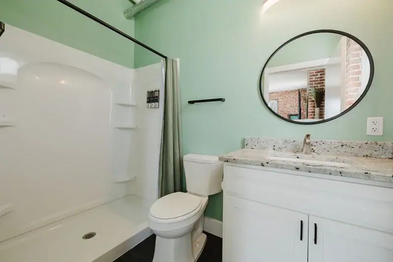 Apt 201 bathroom with walk-in shower and vanity