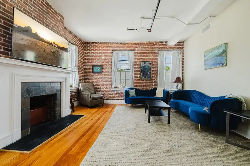 Apt 201 decorative fireplace with brick surround
